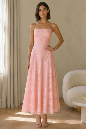 Abito midi elegante a spalline sottili con scollo a fascia, tessuto jacquard floreale e dettaglio a croce sul retro