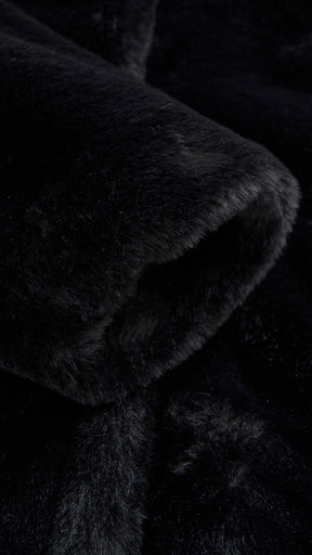 Cappotto medio in peluche sintetica con colletto a revers