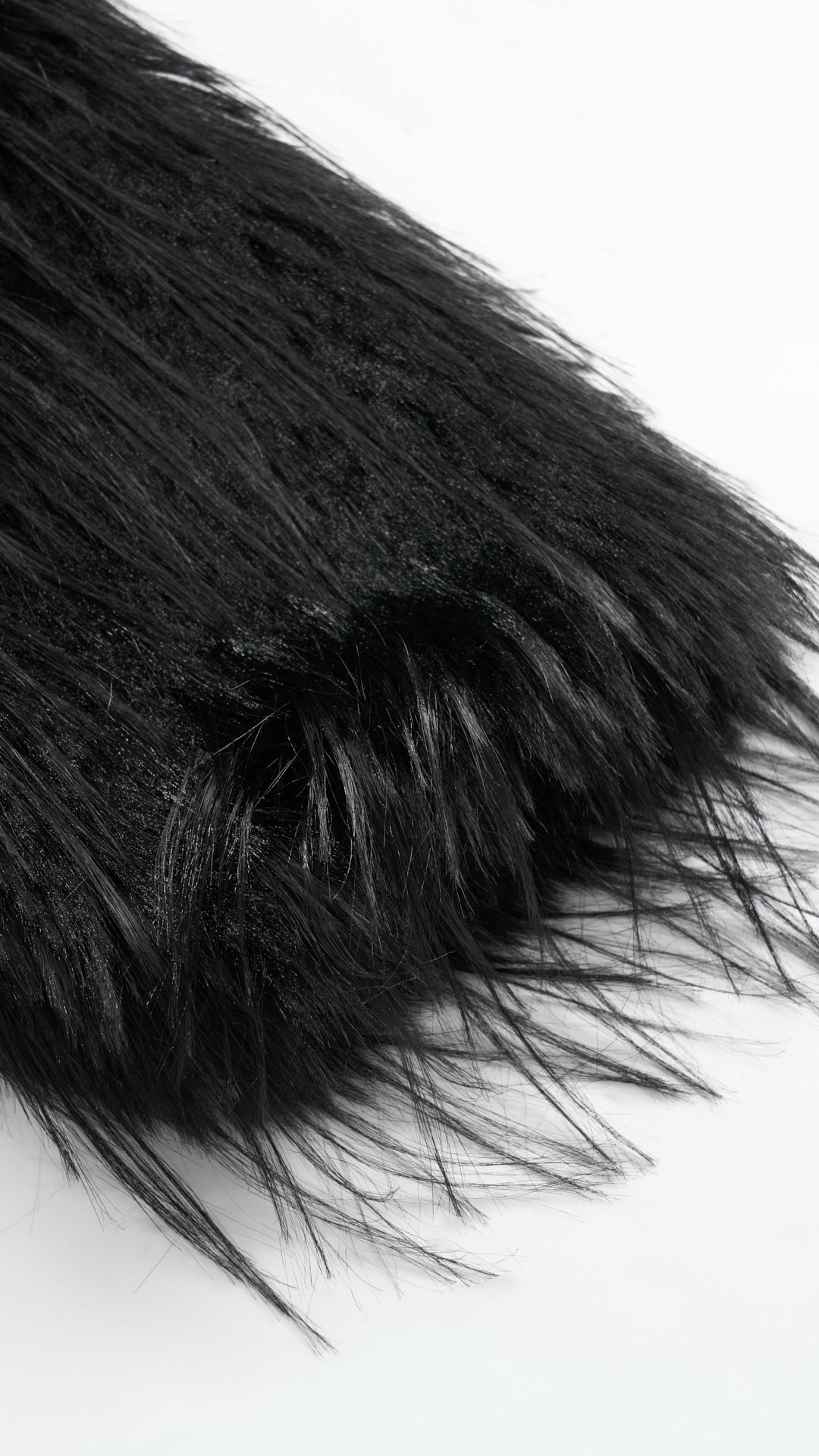 Cappotto corto in pelliccia sintetica a frange con cintura