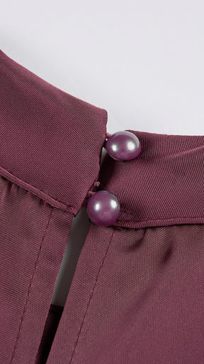 Abito lungo elegante con scollo a collo alto, senza maniche, in raso fluido, per cerimonie e occasioni speciali