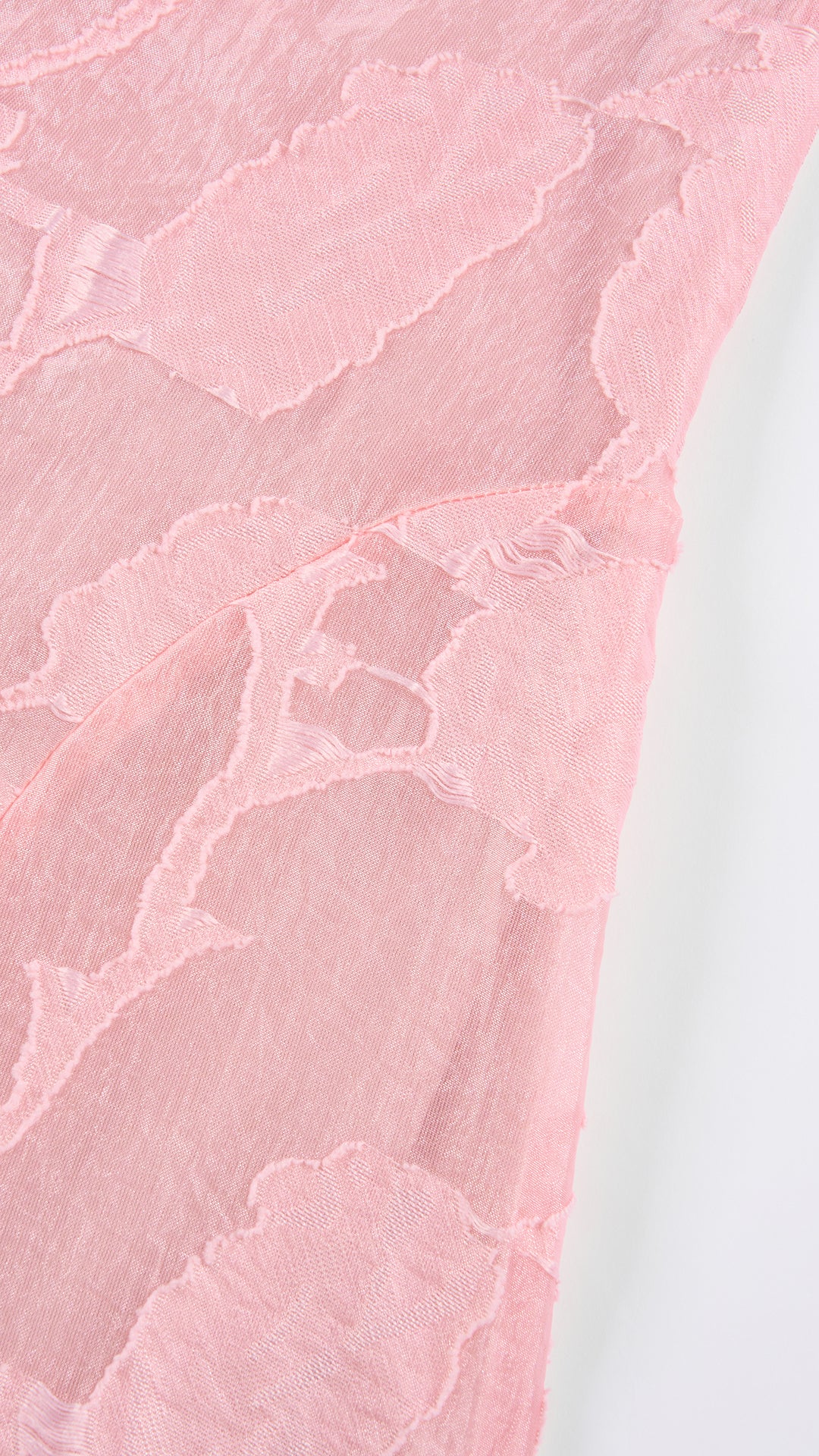 Abito corto elegante a spalline sottili con scollo a fascia, tessuto jacquard floreale e dettaglio a croce sul retro