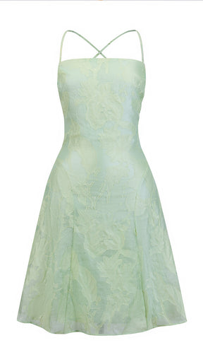 Abito corto elegante a spalline sottili con scollo a fascia, tessuto jacquard floreale e dettaglio a croce sul retro