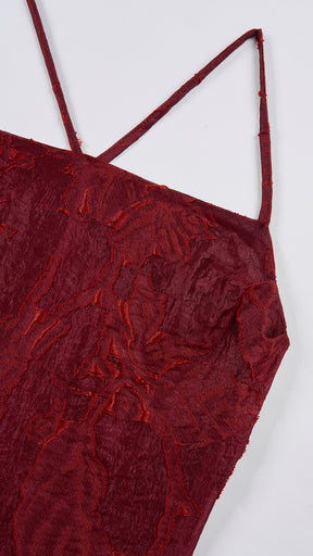 Abito corto elegante a spalline sottili con scollo a fascia, tessuto jacquard floreale e dettaglio a croce sul retro