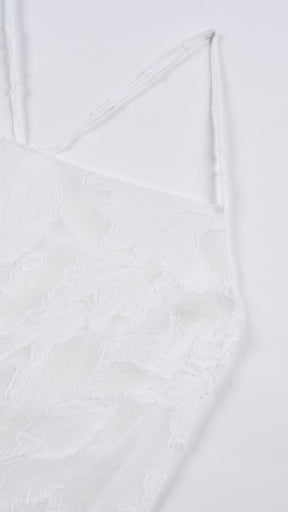 Abito midi elegante a spalline sottili con scollo a fascia, tessuto jacquard floreale e dettaglio a croce sul retro