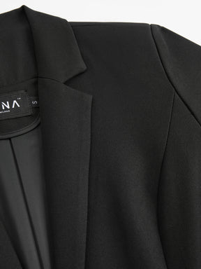 Blazer slim fit da donna: elegante blazer monopetto, adatto per l'ufficio e le occasioni formali.