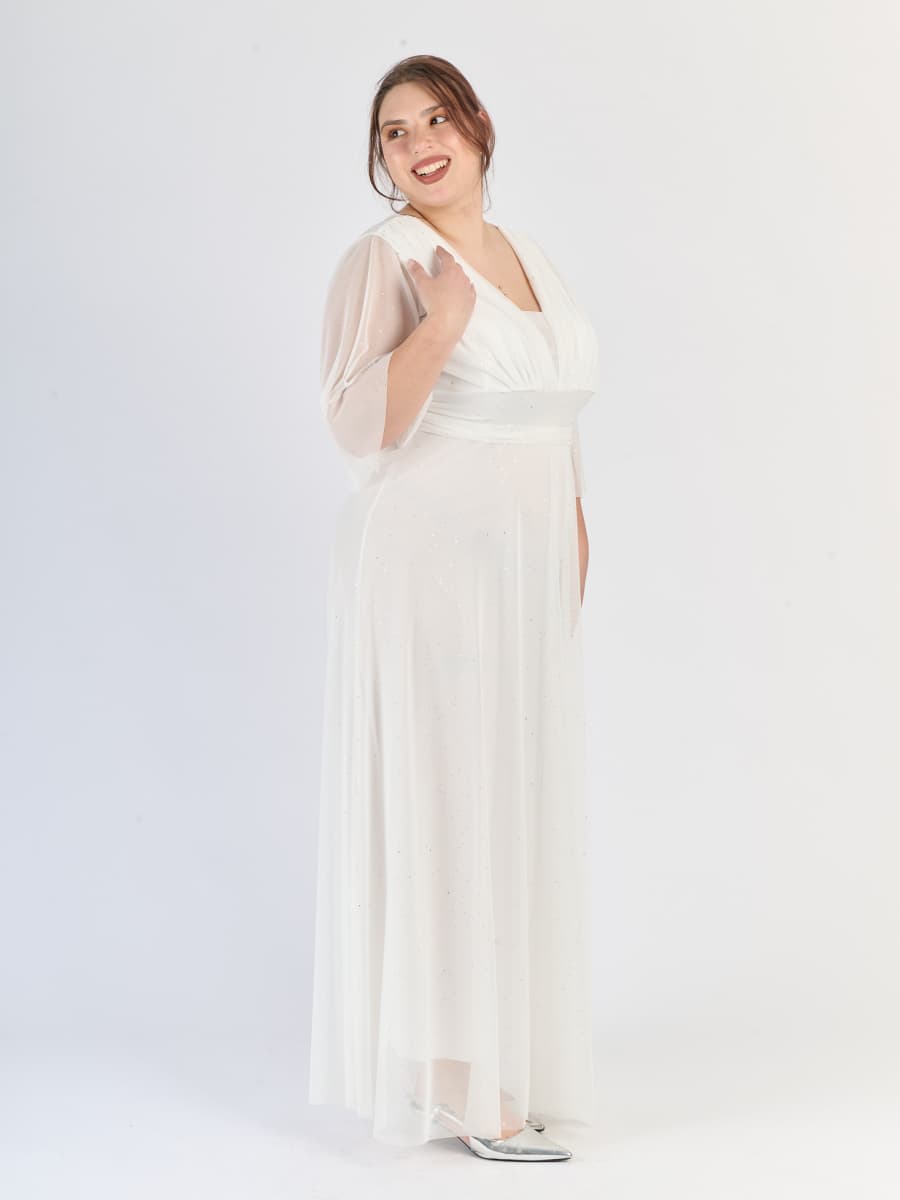 Abito da sera bianco, stile avvolgente con scollatura a V e maniche semi - trasparenti.