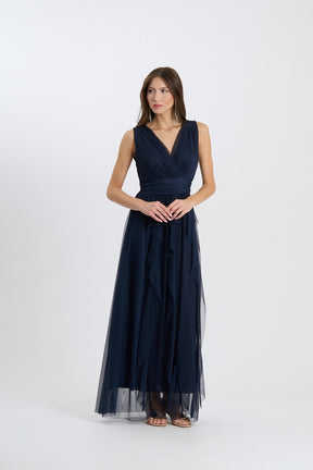 Abito lungo senza spalline di colore navy, scollatura a V incrociata, gonna fluida con tessuto trasparente, perfetto per eventi formali.