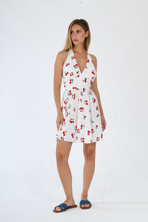 Vestito bianco senza maniche, con spalline larghe e una fascia decorativa alla vita, taglio fluido e lungo.