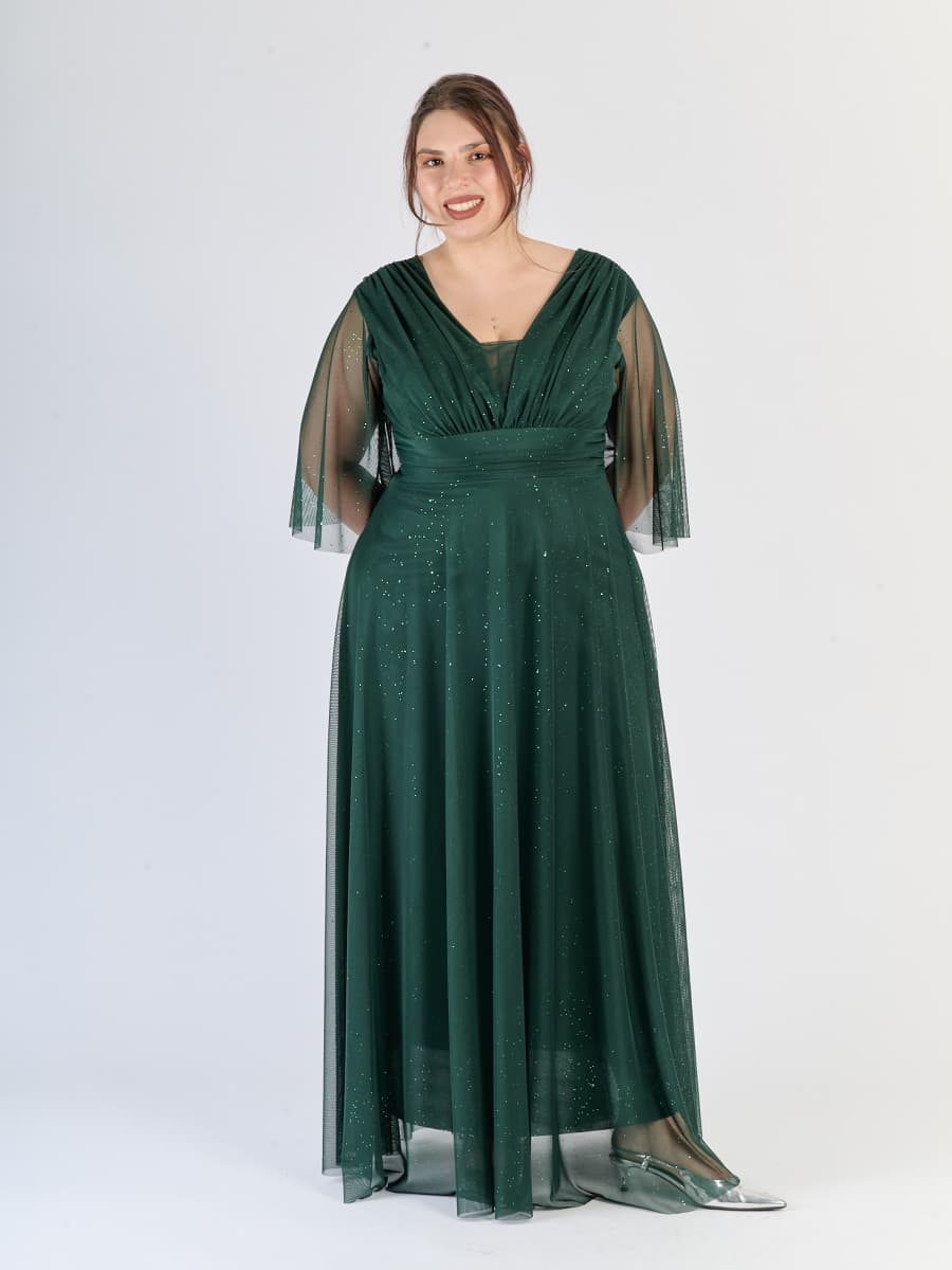 Vestito verde.S elegante, in tulle, con maniche chiffon e vita snodata, un’operaverde.