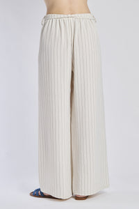 Pantaloni oversize beigi, stile neutro e elegante, coulisse elastica in vita.