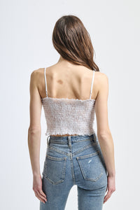 Top freschissimo bianco, ideale per look estivi e occasioni informali.